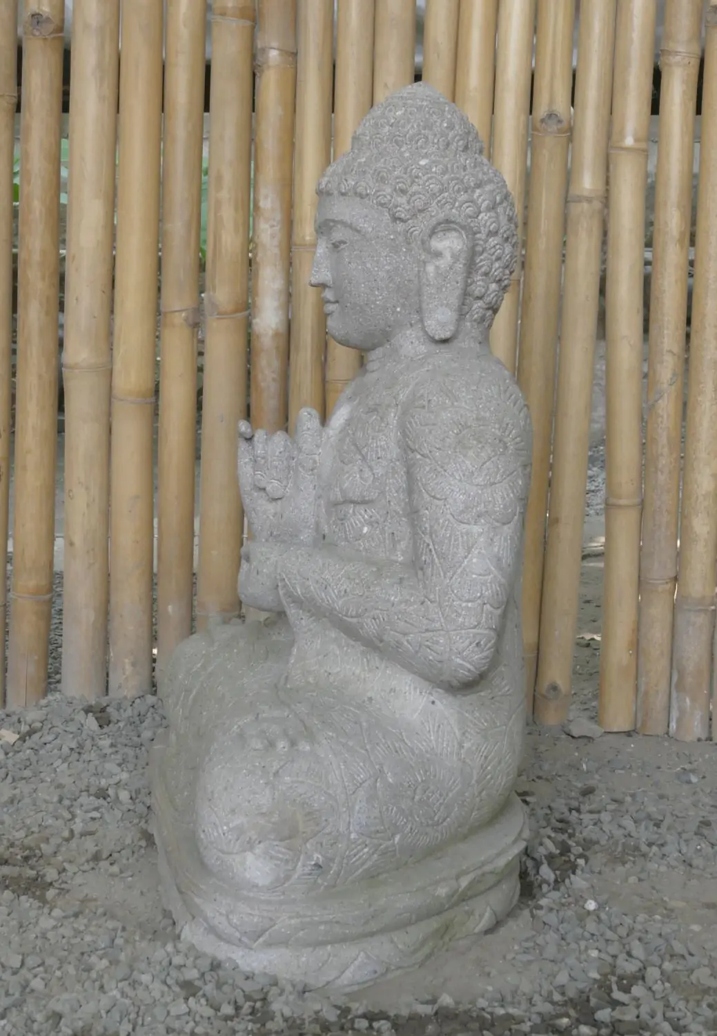  Product image 6 of the product “Seated Buddha with floral carving, Dharmacakra position. 67 cm height. Natural stone (river stone), stonemasonry. There is a stone eye in the chest. ”